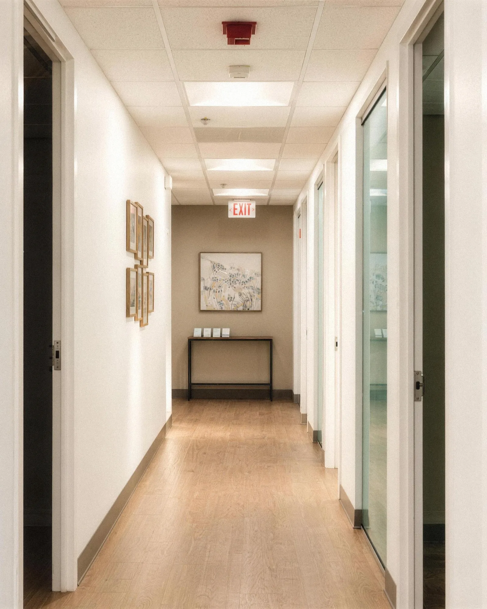 The hallway at our McLean office, with office doors on both sides.